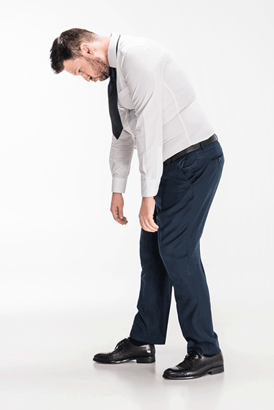 man dressed in shirt and tie flexing forward