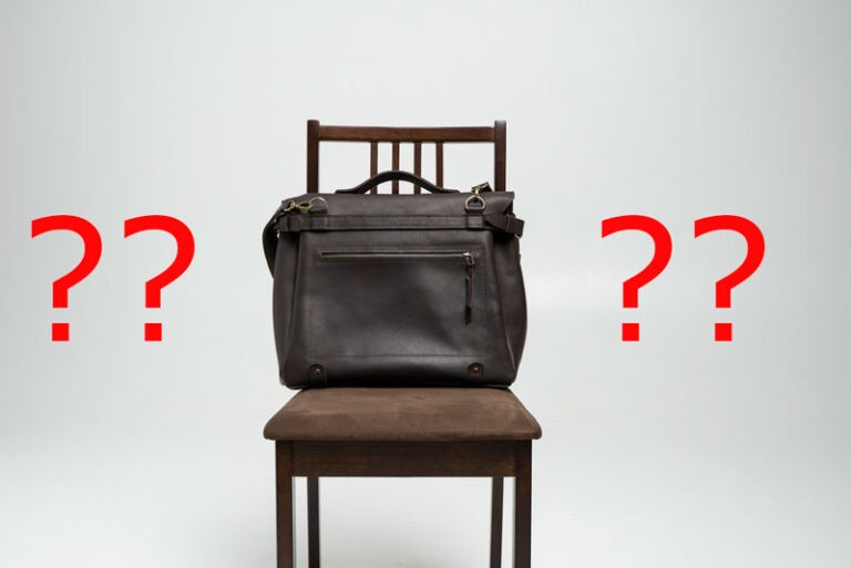picture of shoulder bag on chair surrounded by question marks
