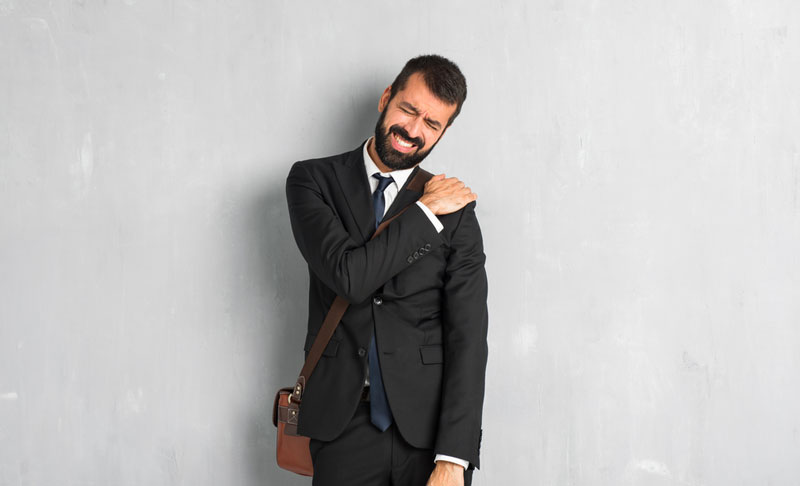 middle aged man wearing shoulder bag with neck and shoulder pain