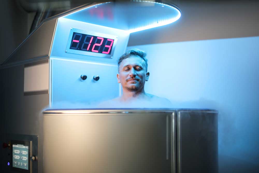 man inside cryotherapy pod