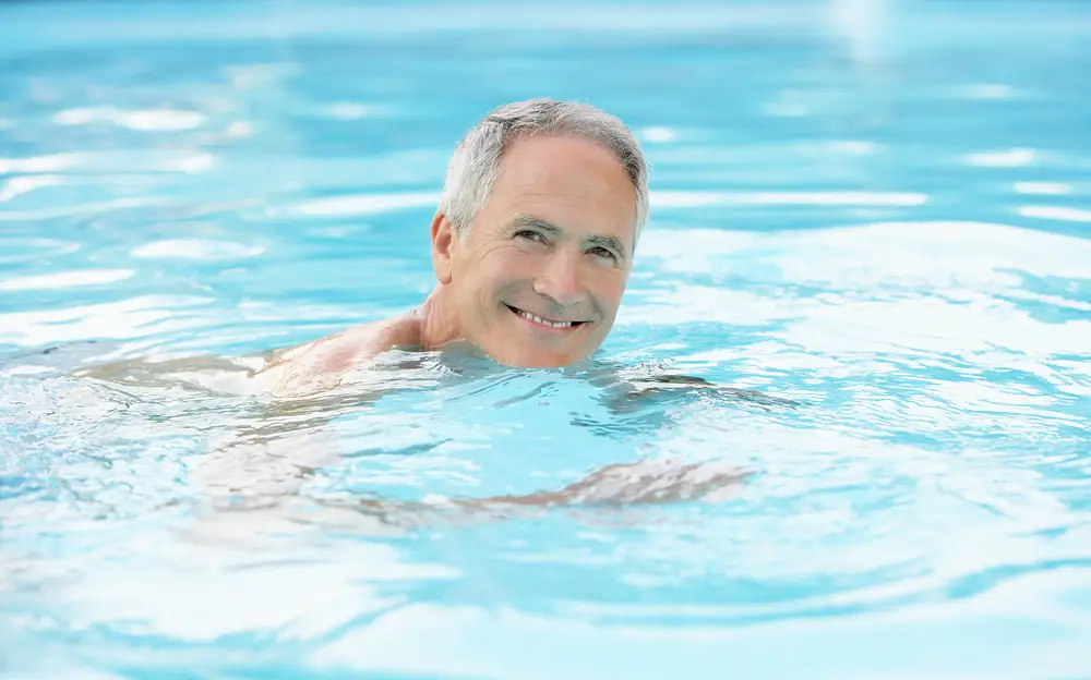 man swimming with herniated disc