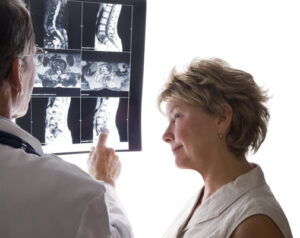 doctor and patient looking at mri back surgery